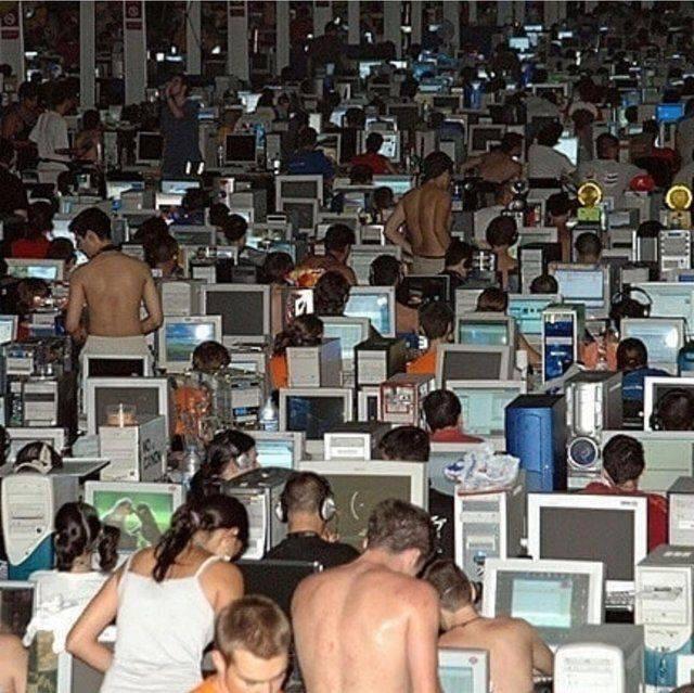 A weird image of a crowded room full of computers.