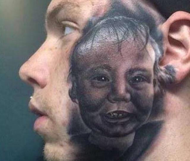 A strange picture of a poorly done baby tattoo on a man's face. 