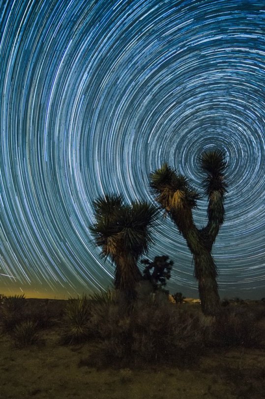 Amazing time-lapse photograph of the night sky in a desert