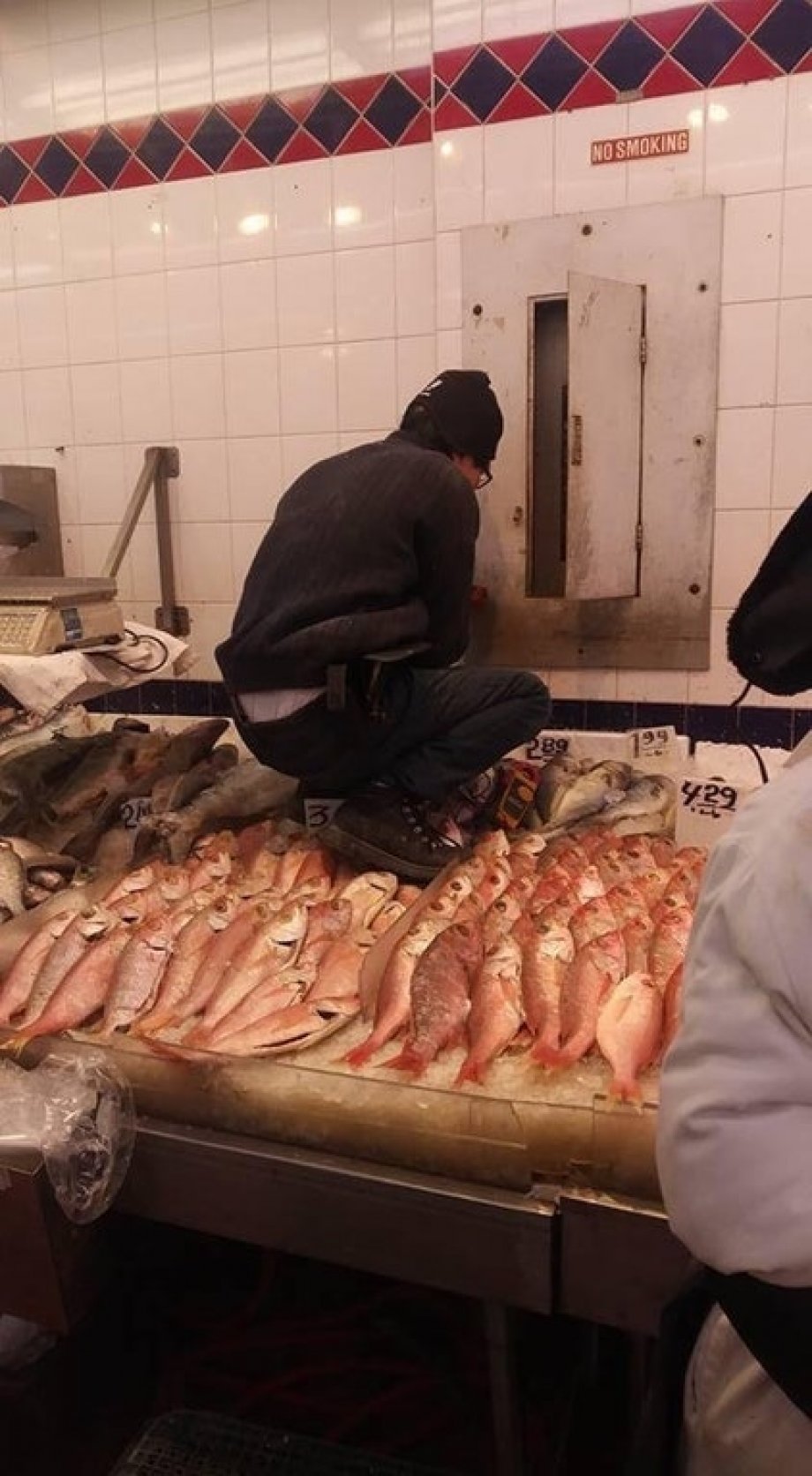 man steps on fish in chinatown - No Smoking 439