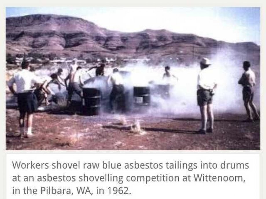 wittenoom mine - Workers shovel raw blue asbestos tailings into drums at an asbestos shovelling competition at Wittenoom, in the Pilbara, Wa, in 1962.