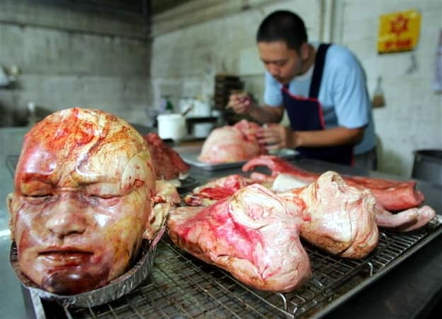 These images of work by Thai artist Kittiwat Unarrom are alarming, but don't call the cops just yet. What appear to be severed human body parts covered in blood are actually loaves of bread baked in grotesque form.
