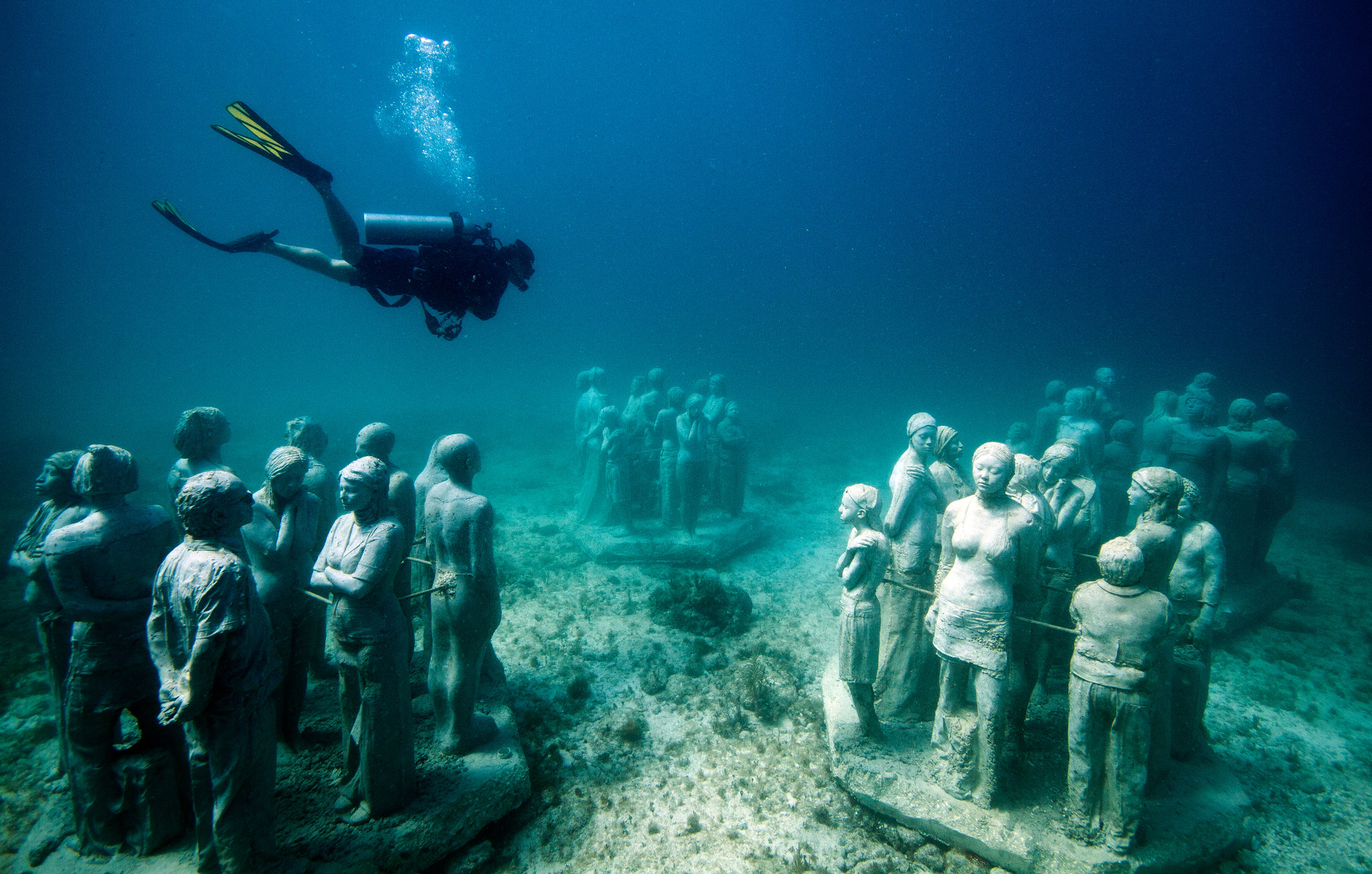 diving underwater statues