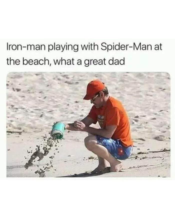 Ironman playing with SpiderMan at the beach, what a great dad