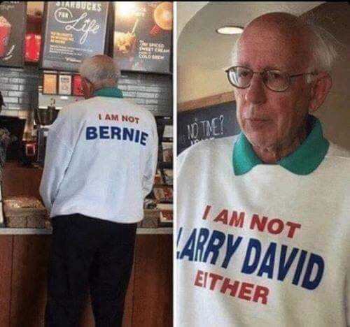 Funny meme of an old man at a Starbucks wearing a sweater that says 'I am not Bernie' on the back and 'I am not Larry David either' on the front