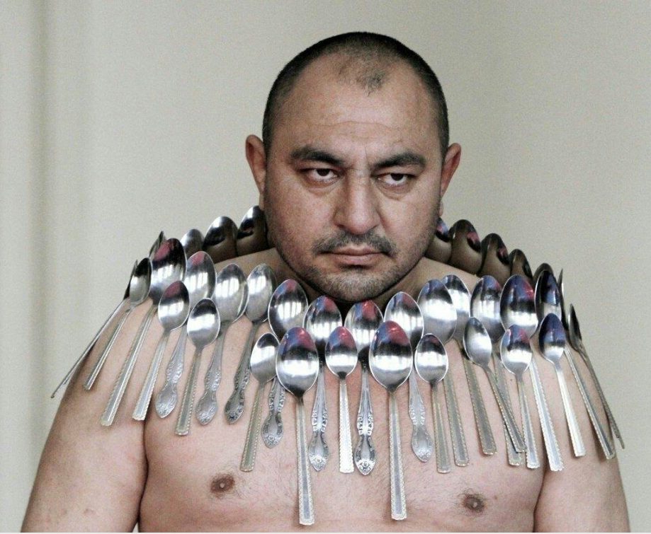 meme - metal spoons on a mans shoulders and chest