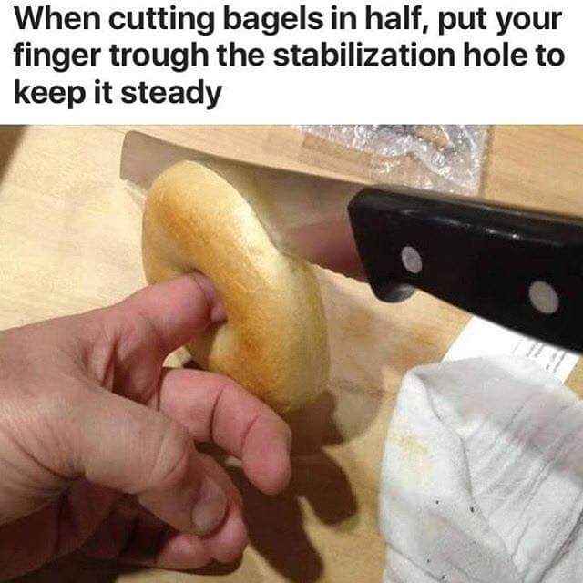 cutting bagels - When cutting bagels in half, put your finger trough the stabilization hole to keep it steady