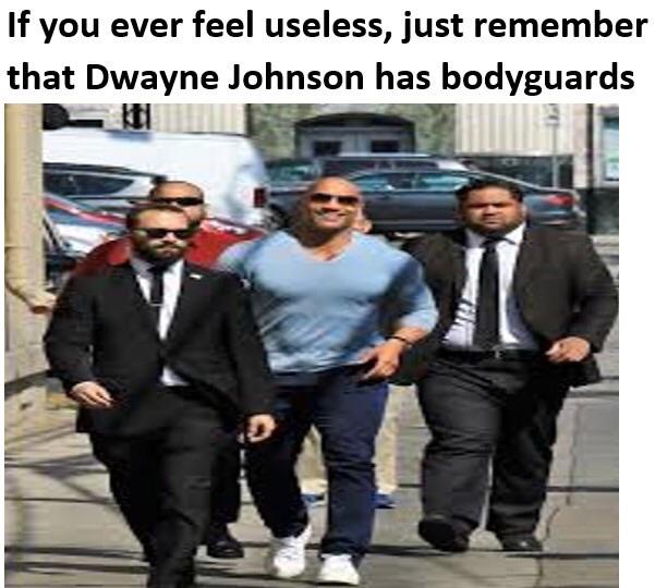 suit - If you ever feel useless, just remember that Dwayne Johnson has bodyguards