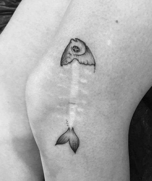 dead fish tattoo scar