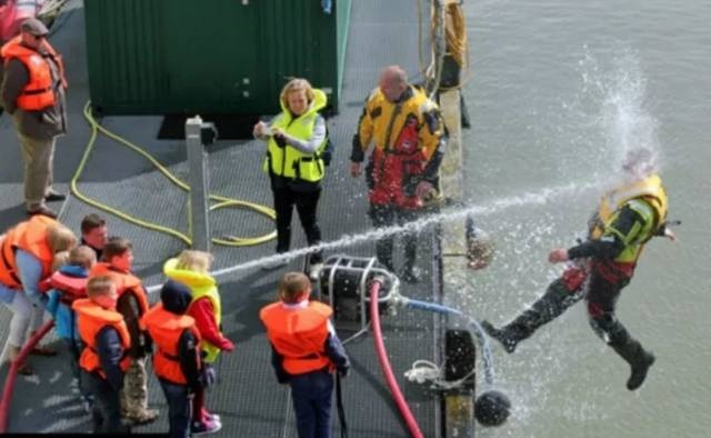 kids playing with fire hose