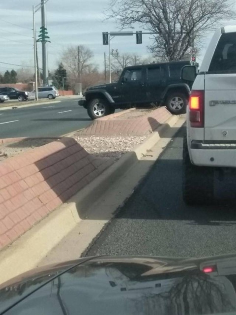 car stuck on median