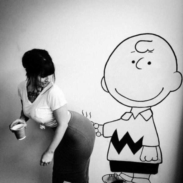 funny pics - of a charlie brown with a finger on a girl