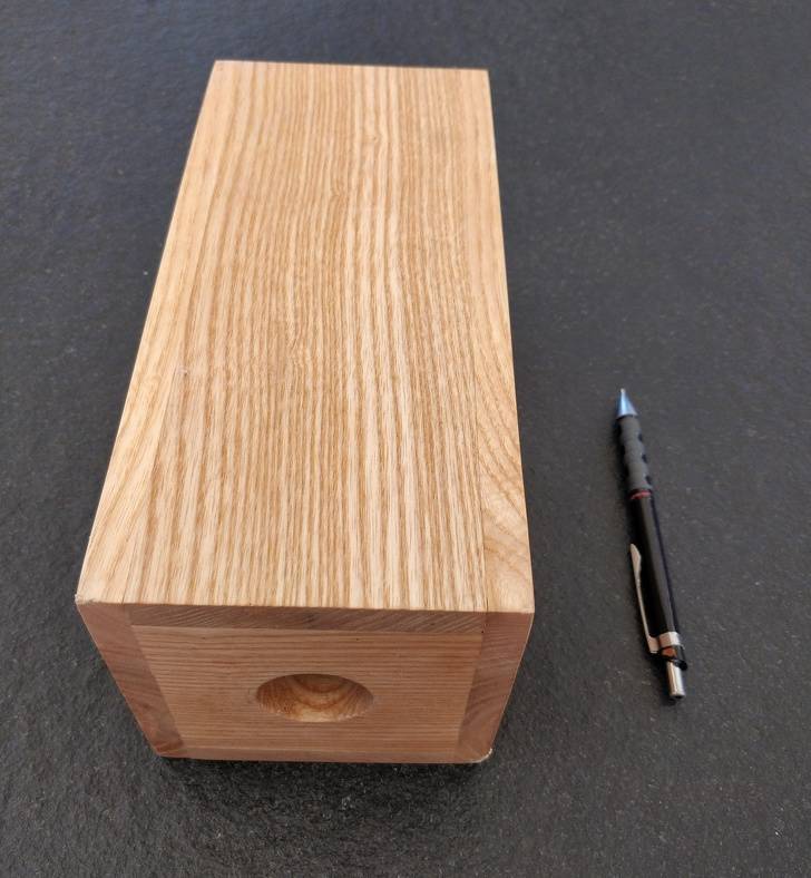 “Found this tall wooden box, it’s open on one end with a hole on the other end. What is this for?”It’s a box to store wine