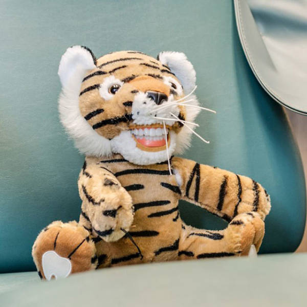Tiger plush toy with human-like teth