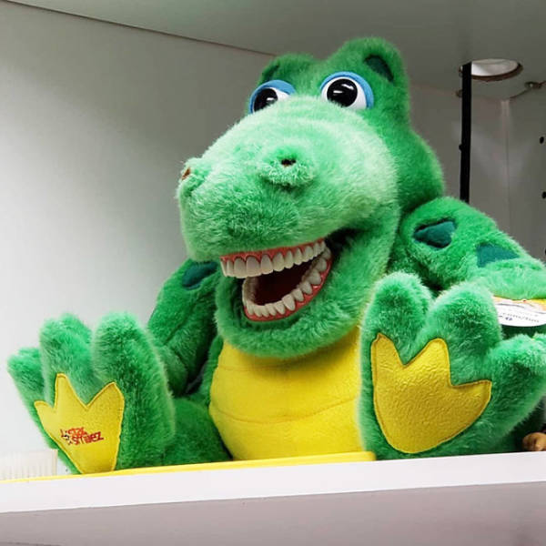 Alligator stuffed animal with human-like teeth