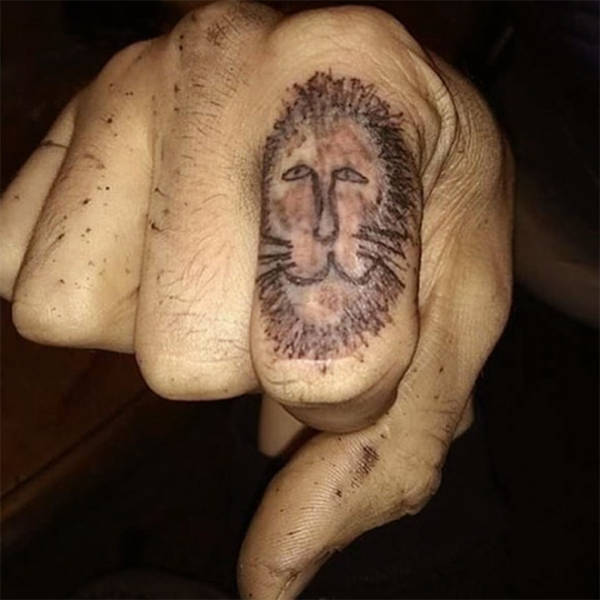 Bad Tattoos - lion tattoo knuckle