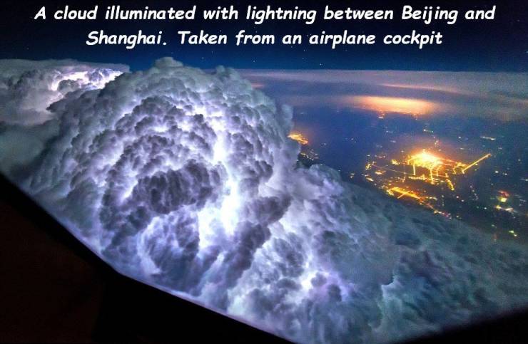 storm from plane - A cloud illuminated with lightning between Beijing and Shanghai. Taken from an airplane cockpit