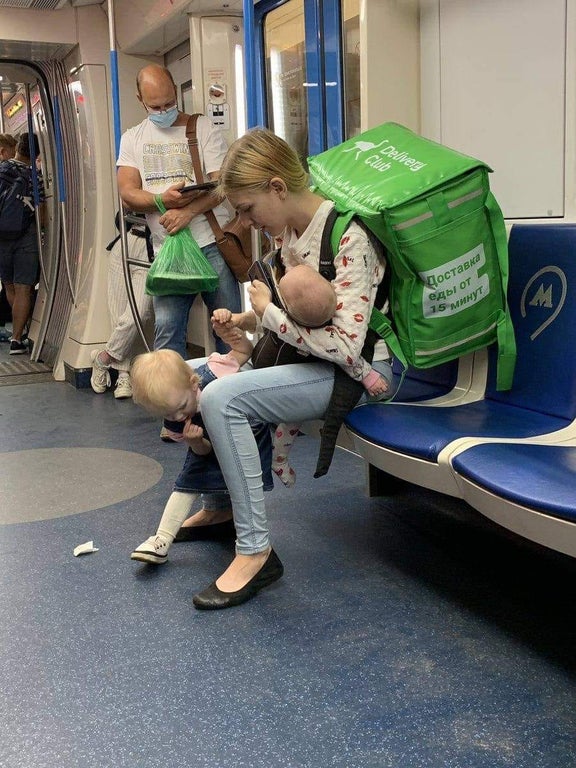funny pics - woman on subway with two kids and huge bag
