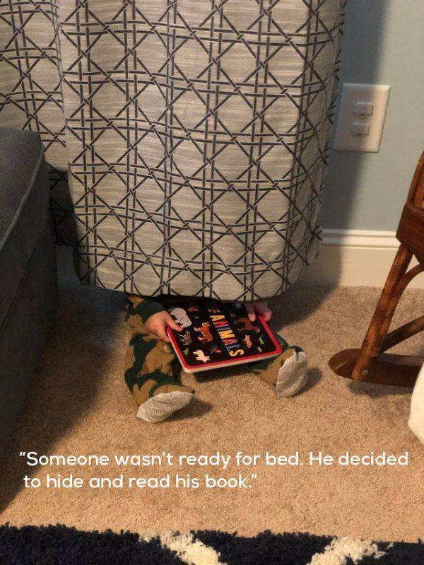 funny random pics - floor - Xx K "Someone wasn't ready for bed. He decided to hide and read his book.