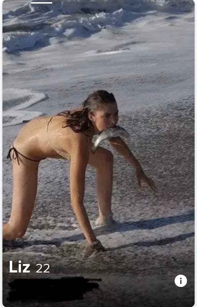 Tinder profile pic - woman hunting fish with her mouth