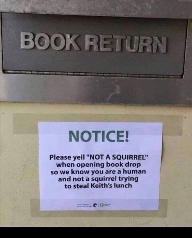 sign - Book Return Notice! Please yell "Not A Squirrel" when opening book drop so we know you are a human and not a squirrel trying to steal Keith's lunch