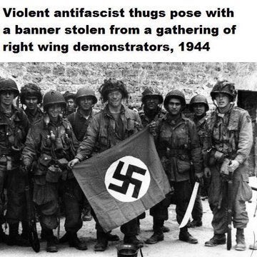 dwight d eisenhower d day - Violent antifascist thugs pose with a banner stolen from a gathering of right wing demonstrators, 1944