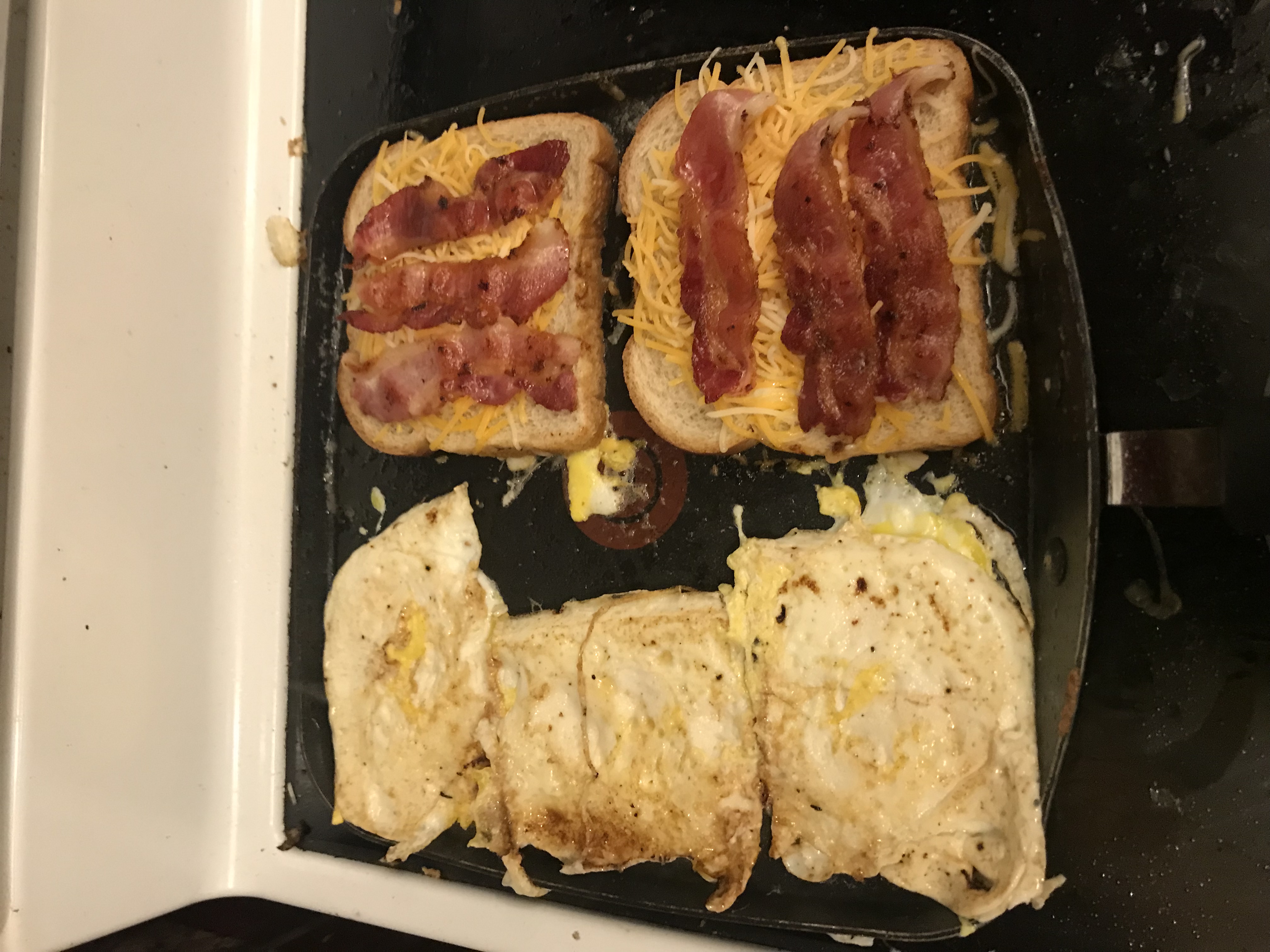 Flip eggs, add lots of cheese and bacon to bread