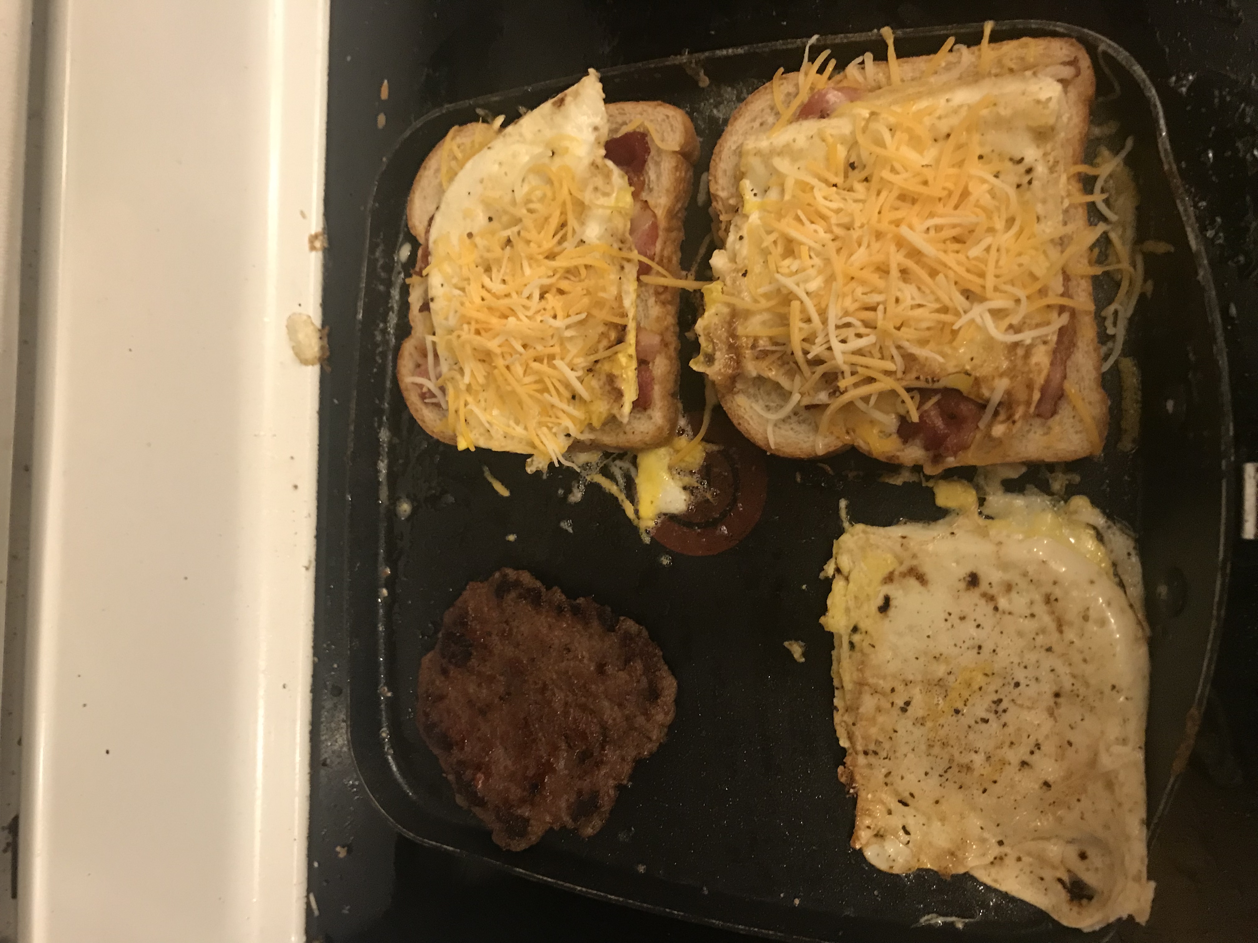 Two eggs on the bread and return sausage to pan