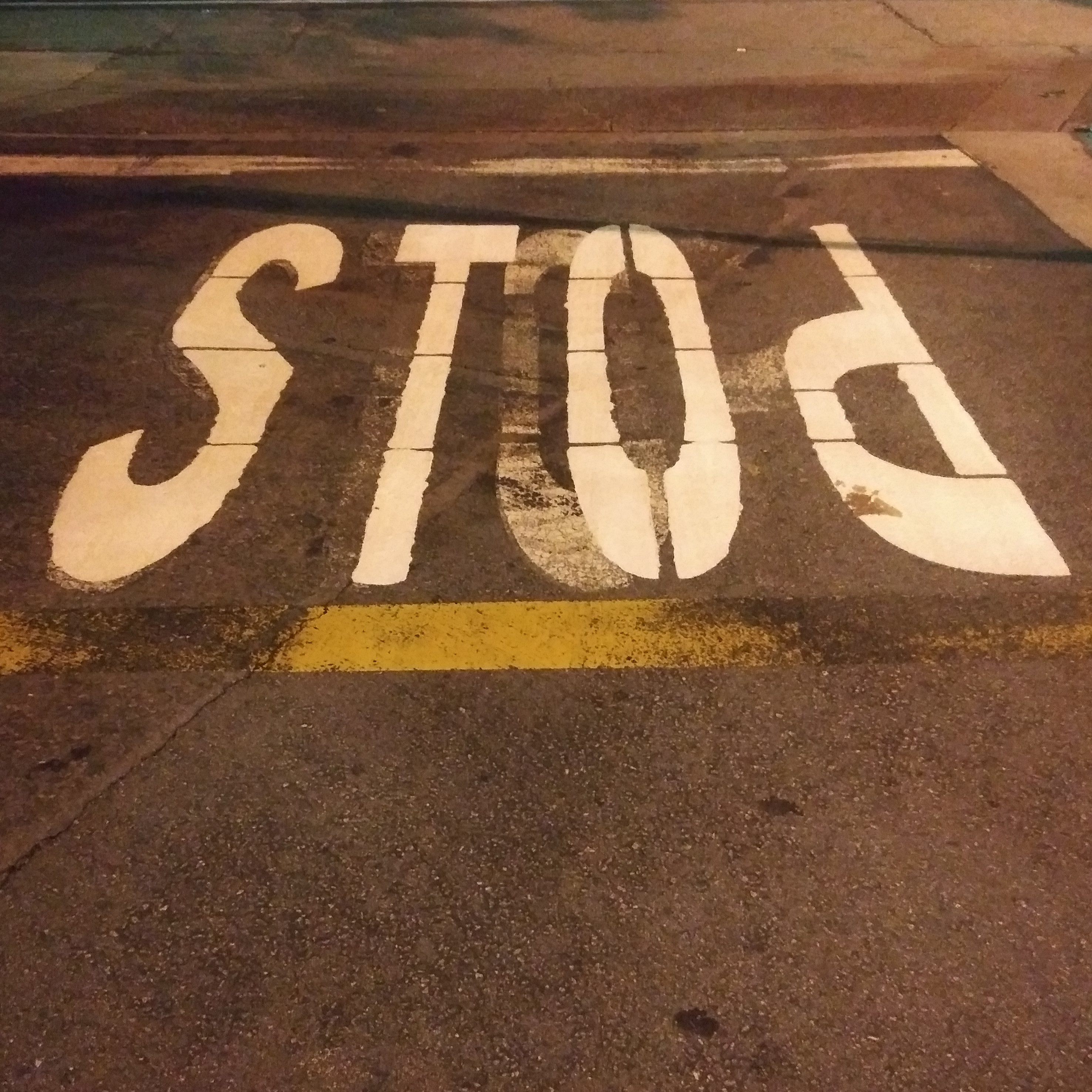 It seems like someone doesn't know how to spell STOP. Upon exiting a parking lot off of SAFEWAY, I noticed the stop on the ground didn't look right. Instead of spelling stop it was spelled stod. So, the p is now a d.