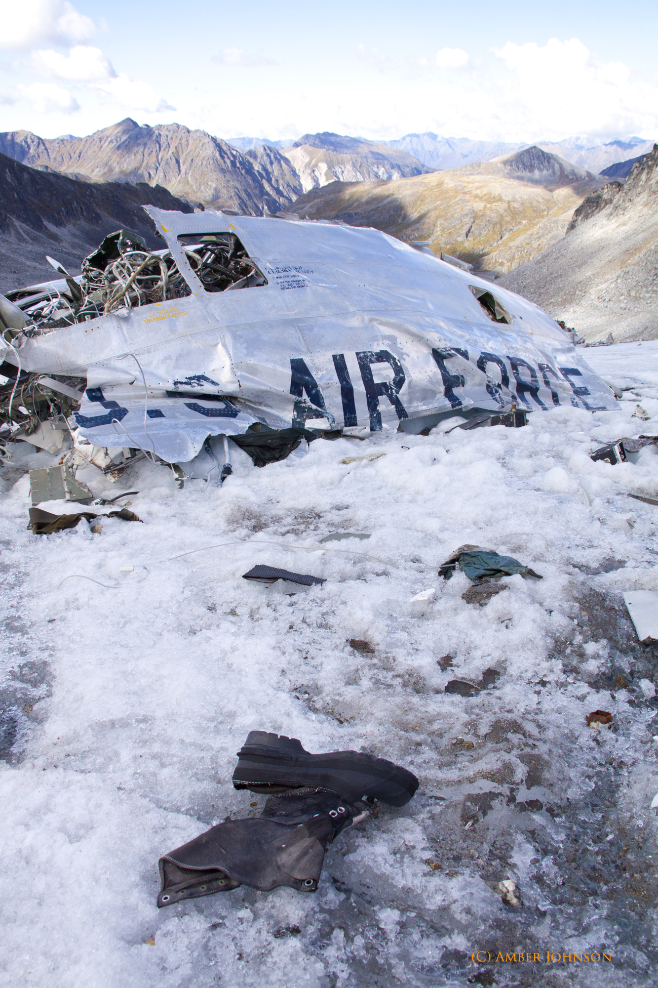 Regardless of your approach, hikers will find the main fuselage of the airplane sunken into the glacier, a black "U.S. AIR FORCE" still readable across the body and wings. One of the wings lies separate from the main wreck, torn away on impact, and another lies across the fuselage. The cockpit and nose of the aircraft is also separate, smashed into the ice further up the glacier. Alongside the engines and landing gear strewn across the glacier are also various controls, wires, and miscellaneous aircraft parts.