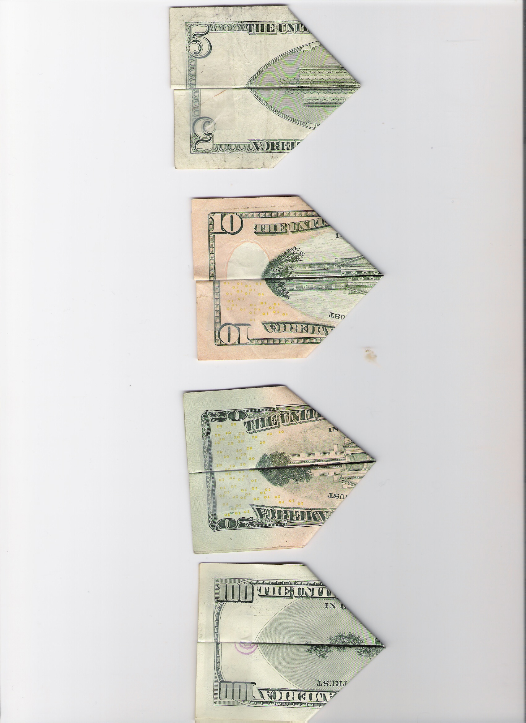 I just did this a couple of minutes ago and scan them to my computer...But starting out with the one its the twin towers just standing...but the higher the money the more damage to the towers are...Then the 100 dollar its just smoke left..just thought it was neat