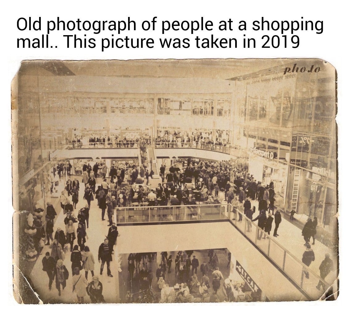 Old photograph of people at a shopping mall.. This picture was taken in 2019 pho.to