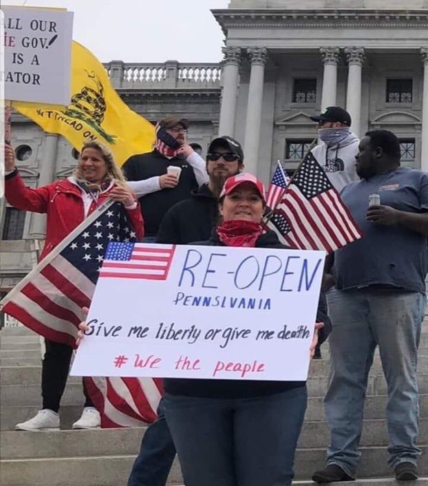 A fine example of ignorance and stupidity. Can't spell the state she lives in or the word people. Flag on the sign had to be done by a child and the ass clown who is allowing the U.S. flag to drag on the ground.