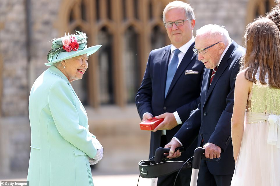 'If I kneel down I'll never get up again, Ma'am': Captain Sir Tom Moore shares joke with the Queen as she knights at Windsor Cas