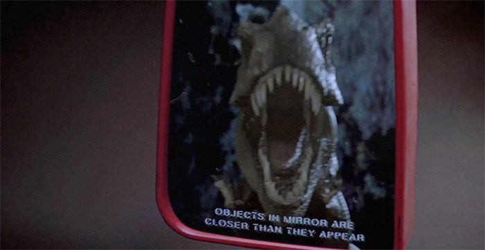labels and warnings people ignore - jurassic park t rex in mirror - Objects In Mirror Are Closer Than They Appear