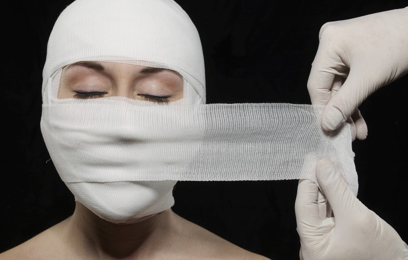 Traumatizing childhood events - woman bandages face