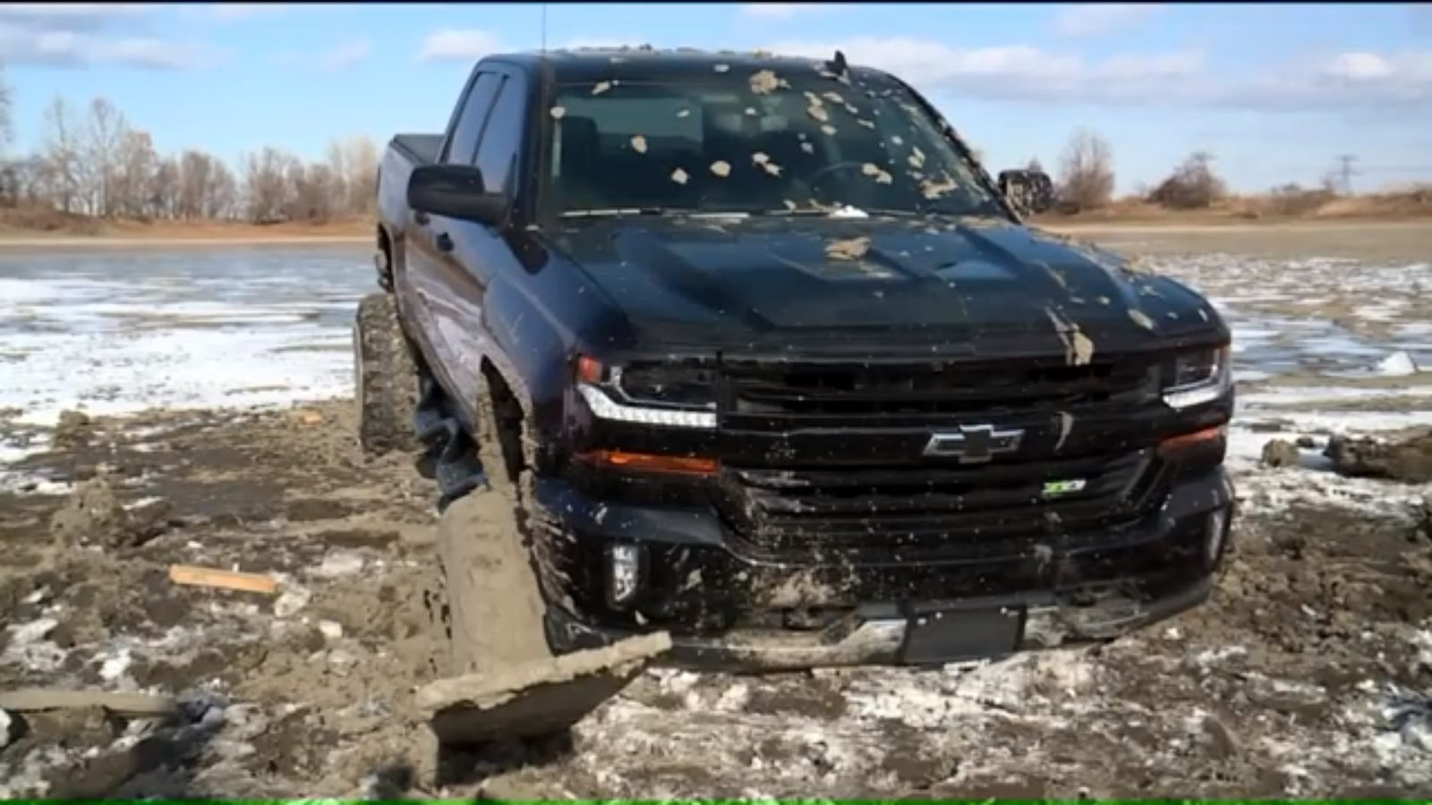 stupid badass moves - truck stuck in the mud