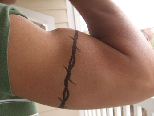 stupid badass moves - barbed wire tattoo bicep