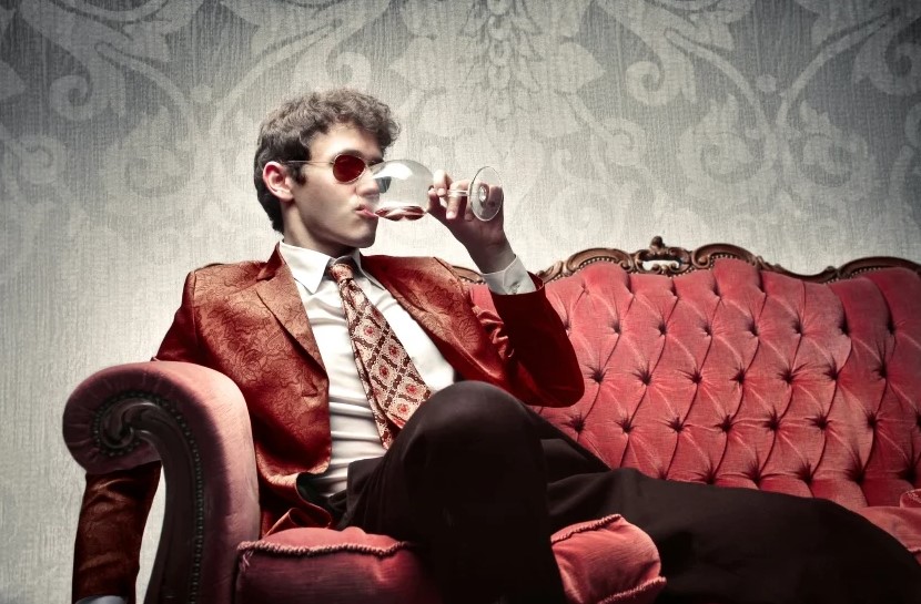 double standard rich vs poor - man sitting drinking wine
