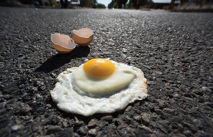Street Smarts - cooking egg on asphalt
