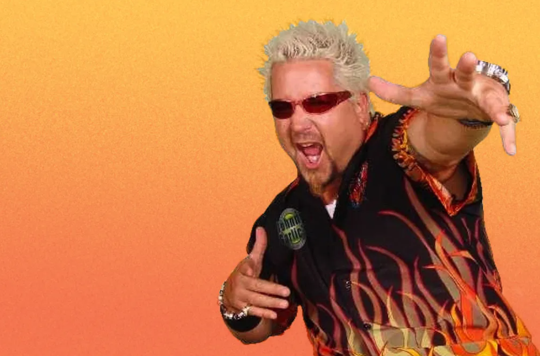 Meme King
 
It’s nearly impossible to discuss Guy Fieri without discussing his appearance. He’s kind of an entire spectrum element: one part flame-covered shirt, one part frosted hair. If you could time travel to 2004 and show people his picture before his breakout Food Network success, many would assume he was a fictional character rather than one of the most successful chefs in the world.
 
However, it’s actually Fieri’s extreme appearance that has helped make him popular to younger generations. Children born in the 90’s and the early 2000’s are sometimes referred to as “the internet generation,” and this generation of digital natives has mastered the art of communication through memes. Fieri has been part of meme culture since he first won big on Food Network, and now his brand is kept alive via countless memes. The fact they are often shared by people who have never watched Diners, Drive-Ins, and Dives is purely incidental!