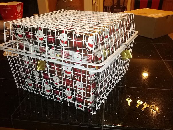 funny christmas presents - christmas present inside a locked cage