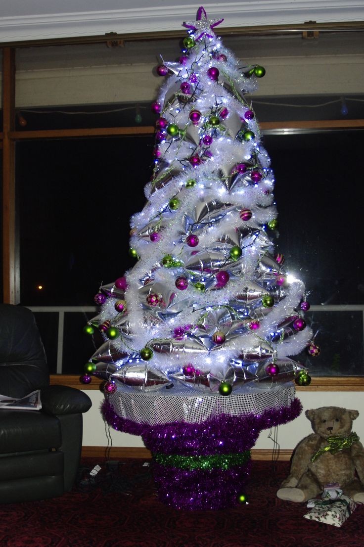 My Mum makes her Christmas tree. This year she made it out of wine pillows or goon bags as we call them in Australia. She has also made others out of Cds, hanging ones, styrofoam etc but this is the best. She had to drink heaps of wine to make it . Each bag is from a 4litre cask so it was a very happy year getting ready to make this/