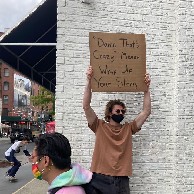 dude with sign 3