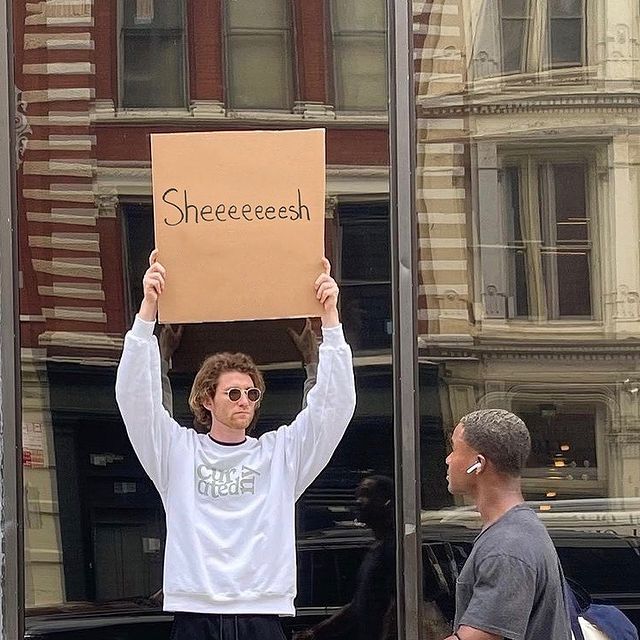 dude with sign 11
