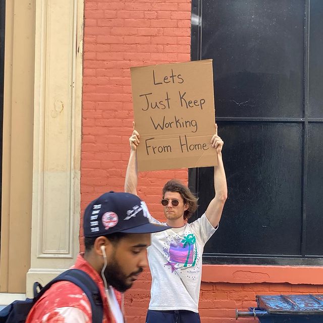 dude with sign 14