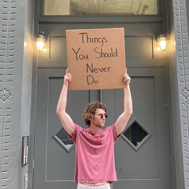 dude with sign 17