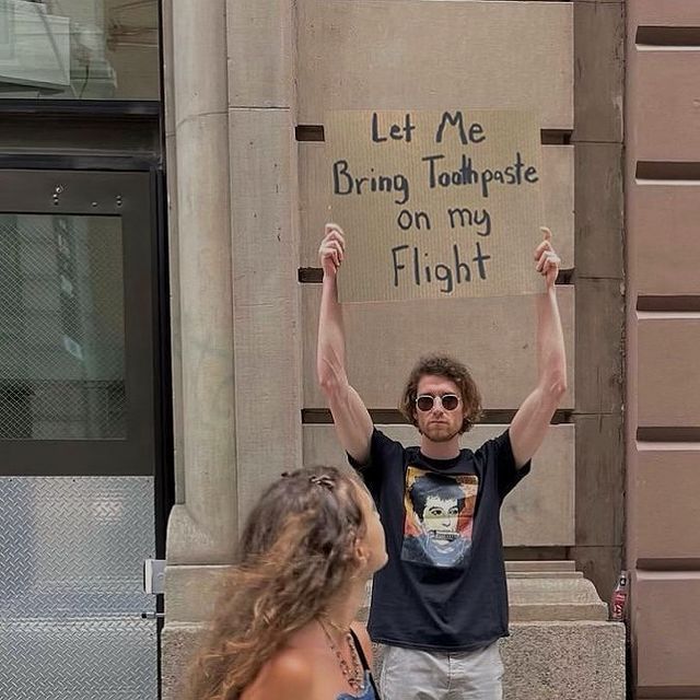 dude with sign 18