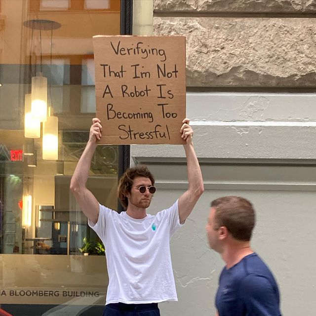 dude with sign 22