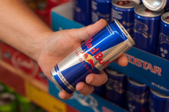 honest slogans  - red bull can in hand